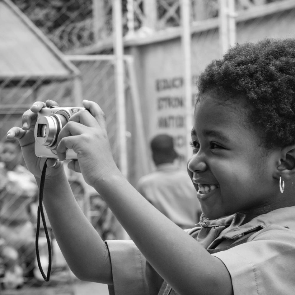 Child holding a camera